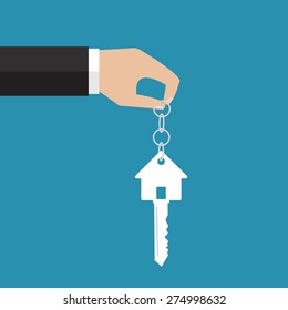 Buying the house. The hand holding a house key. Vector illustration