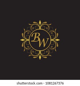 BW Initial logo. Ornament ampersand monogram golden logo black background