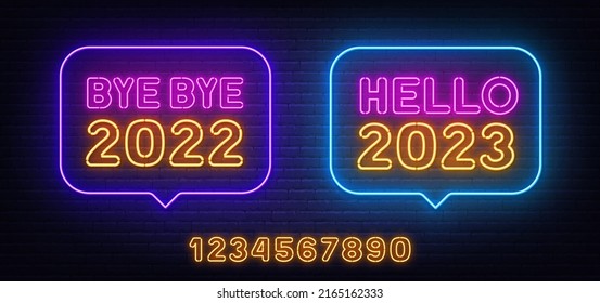 Adiós 2022 y Hola 2023, señal de neón en la burbuja del discurso sobre fondo de pared de ladrillo.