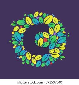 C letter logo in a circle of leaves and flowers. Font style, vector design template elements for your vegan or ecology application or corporate identity.