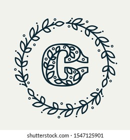C letter logo consisting of floral pattern in a circle laurel wreath. Linear heraldic vector font. Can be used for boutique, cafe, restaurant, royalty, hotel, jewelry or sport industry.