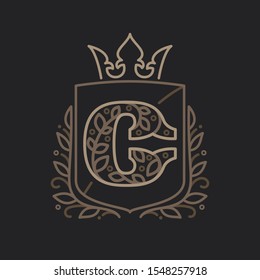 C letter logo consisting of floral pattern letters in a heraldic shield with crown. Can be used for security, hotel, resort, restaurant, boutique, jewelry, interior and fashion industry.
