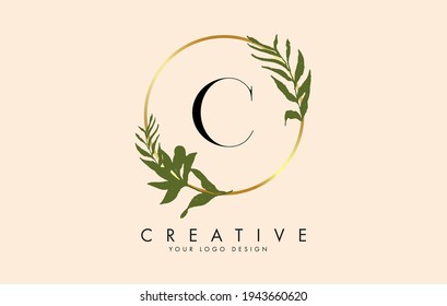 C Letter logo design with golden circles and green leaves on branches around it. Vector Illustration with C letter for personal branding, corporate, business, eco friendly or natural products. 