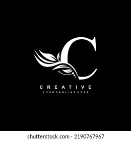 C letter logo vector design with leaf decoration. monogram C, typography. feather logo. luxury C. C flourish. suitable for logo of business, company, product, boutique, wedding, hotel, etc