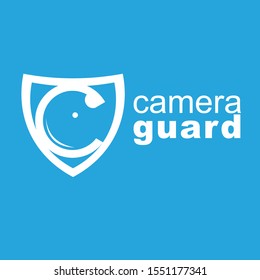 C shaped camera lens in a shield isolated on blue background can be used as logo for camera protection products 
