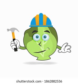 The Cabbage mascot character becomes a builder. vector illustration
