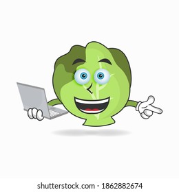 Cabbage mascot character with laptop in right hand. vector illustration