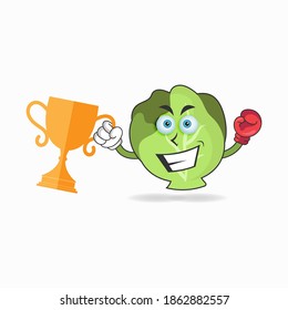 The Cabbage mascot character wins a boxing trophy. vector illustration