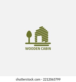 Cabin logo made of wood and there is a tree next to it.