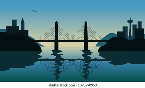 Cable bridge over strait against sunset. Flying plane over the city on the background