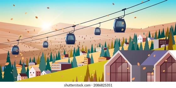 cableway in mountains residential houses area ski resort in autumn season sunset landscape background