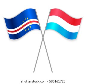 Cabo Verdean and Luxembourgish crossed flags. Cape Verde combined with Luxembourg isolated on white. Language learning, international business or travel concept.
