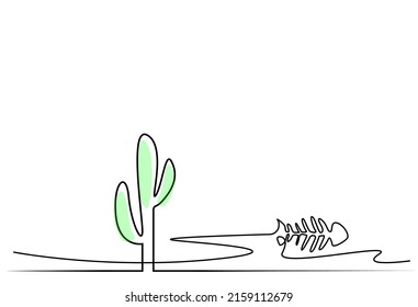 a cactus and an animal skeleton in the desert