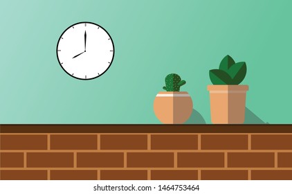 
The cactus tree , placed on a brick with a clock