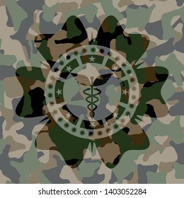 Caduceus medical icon inside camouflage texture