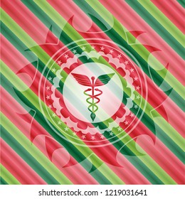 Caduceus medical icon inside christmas badge.