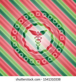 Caduceus medical icon inside christmas style emblem.