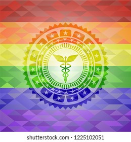 Caduceus medical icon inside emblem on mosaic background with the colors of the LGBT flag