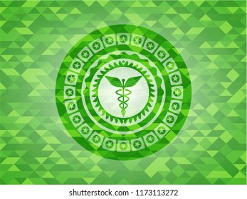 Caduceus medical icon inside green mosaic emblem
