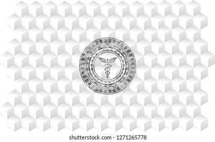 Caduceus medical icon inside grey badge with geometric cube white background