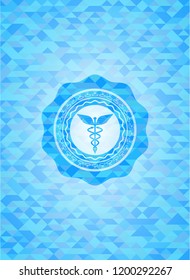 Caduceus medical icon inside realistic sky blue mosaic emblem