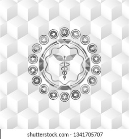 Caduceus medical icon inside realistic grey emblem with geometric cube white background