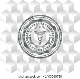 Caduceus medical icon inside realistic grey emblem with geometric cube white background