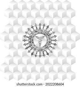Caduceus medical icon inside realistic grey emblem with geometric cube white background. 