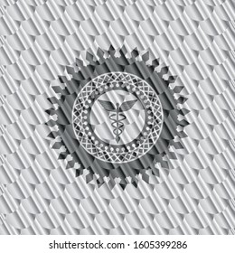 Caduceus medical icon inside shiny silver badge. Scales pattern. Vector Illustration. Detailed.