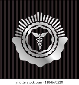 Caduceus medical icon inside silver shiny emblem
