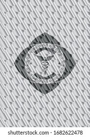 Caduceus medical icon inside silver shiny badge. Scales pattern. Vector Illustration. Detailed.