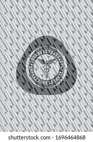 Caduceus medical icon inside silver color emblem or badge. Scales pattern. Vector Illustration. Detailed.