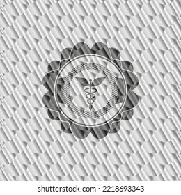 Caduceus medical icon inside silver badge or emblem. Scales pattern. Vector Illustration. Detailed. 