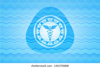 Caduceus medical icon inside water wave representation emblem.