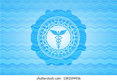Caduceus medical icon inside water badge.
