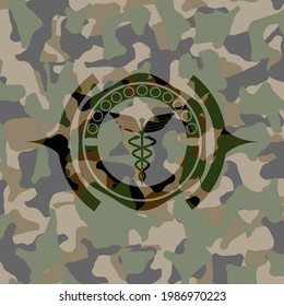 Caduceus medical icon on camo texture. 