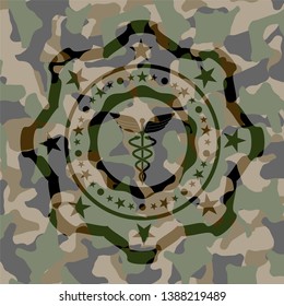 Caduceus medical icon on camouflage texture