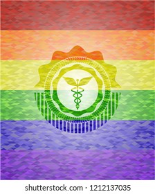 Caduceus medical icon on mosaic background with the colors of the LGBT flag