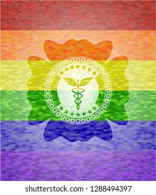 Caduceus medical icon on mosaic background with the colors of the LGBT flag