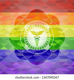 Caduceus medical icon on mosaic background with the colors of the LGBT flag