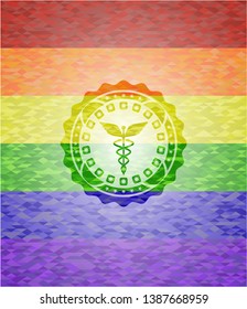 Caduceus medical icon on mosaic background with the colors of the LGBT flag