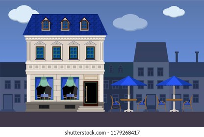 Cafe in the historic part of the city building is a classic style with tables on the street.