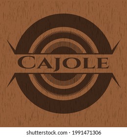 Cajole badge with wood background. 