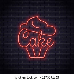Cake neon logo of bakery. Cupcake dessert neon sign on wall background