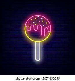 Cake Pop With Sprinkles Neon Icon. American Tasty Ball. Sweet Shop Logo. Bakery Emblem. Night Bright Signboard On Brick Wall Background. Outer Glowing Effect. Vector Stock Illustration