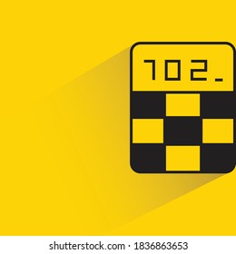 calculator with drop shadow on yellow background