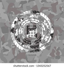 calculator icon inside grey camo emblem