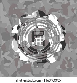 calculator icon inside grey camo emblem
