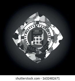 calculator icon inside grey camouflaged emblem