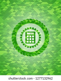 calculator icon inside realistic green emblem. Mosaic background